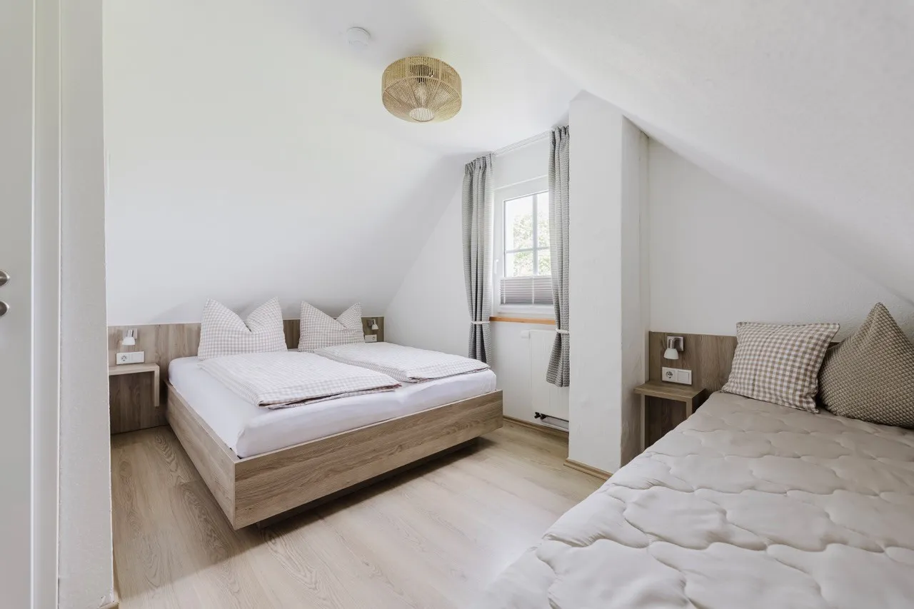 Second bedroom in the holiday home with a double bed and a sofa bed